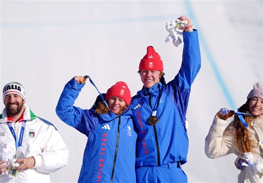 GB’s Charlotte Bankes and Huw Nightingale make history with stunning Olympic gold in mixed snowboard cross