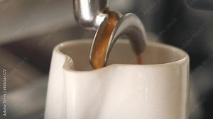 Process of Making Fresh Coffee on Professional Machine. 4K, Macro Slowmotion.