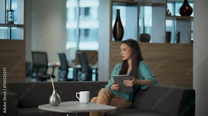 Stressed woman putting tablet aside at workplace. Angry manager having problems