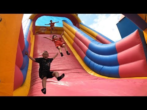 Crazy GIANT Inflatable SLIDE Fairground Ride - Hale Village Carnival