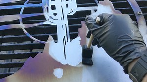 Using acid to remove the color of heat treated metal