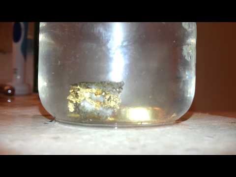 Vinegar dissolving Calcite? from a gold specimen