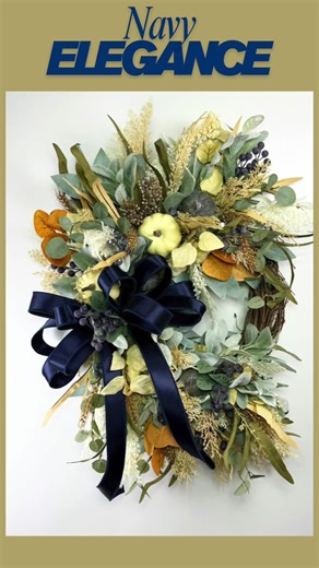 Meet your new favorite fall wreath! 🍂 This neutral pumpkin beauty features a deep navy ribbon, soft greenery, and farmhouse charm. Whether it’s for your door or gifting, it’s ready to ship and ready to wow. #fallhomedecor #neutralfallwreath #pumpkindecor #handmadewreath #autumndecor