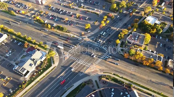 Autumn Splendor Unveiled: Witness the captivating dance of fall foliage along Boulder's 28th Street, captured from a stunning aerial perspective by a soaring drone