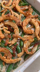 This skillet green bean casserole is a Thanksgiving classic made on the stovetop with less dishes and less oven space involved! This recipe is paleo, whole30, vegan, gluten-free, and dairy-free. For the fried onions ¼ cup arrowroot strach ¼ cup coconut flour Salt & pepper 1 large white onion, halved and sliced thin ⅓ cup coconut milk ⅓ cup coconut oil For the green bean casserole 1 lb green beans 1 ½ cup canned coconut milk ¾ cup broth, chicken or vegetable broth Salt & pepper 2 tsp apple cider 