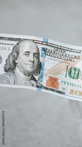 American banknotes 100 dollar bills on the table close-up. Wallet with money for investment and business. Investor and banker counts his savings