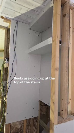 Little Welsh House & Chapel on Instagram: "Yesterday Rob started putting up the shelves at the back of the stairs — this little corner is soon to become the sweetest reading nook, right in front of the middle window at the top of the cottage. He’s building shelves for all the books and a sneaky hidden shelf behind them for all the internet bits and bobs. Upstairs wiring is now complete, the plasterboard is going on, and once he’s sanded those ceilings we can finally start piecing everything toge