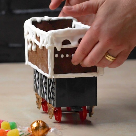 1.5M views · 2.7K reactions | A fun and unique way to deliver holiday treats to your guests! This toy train is outfitted with a gingerbread shell and equipped with candy cargo. Recipe: https://tasty.co/recipe/gingerbread-train-buffet | Tasty | Facebook
