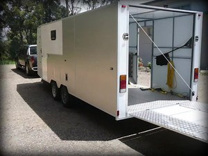 This magnificent enclosed trailer was built by Bruce who used one of our flatbed plans (with some extensive modifications) to put this enclosed trailer together. The trailer internal area is split into a front living area and a large rear load area with external access doors in each zone. The floor is clad with aluminium chequer plate and the body frame is made from 25mm steel RHS. Walls are a combination of 20mm fiberglass/foam and 3mm aluminium faced composite panels. This has helped keep the 