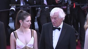 Paul Verhoeven and Daphne Patakia grace the carpet at Cannes