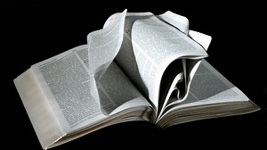 Bible pages turning in the wind on black background | Free Stock Video Footage