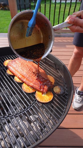 Your new favorite summertime salmon recipe. Cooked over citrus and finished with a sweet and spicy chili sauce, this salmon was so good! Shoutout to @eatwitzo for the idea! #grillinwithdad #salmon #bbq #grilling #recipe #grill #foodie #summer #tasty