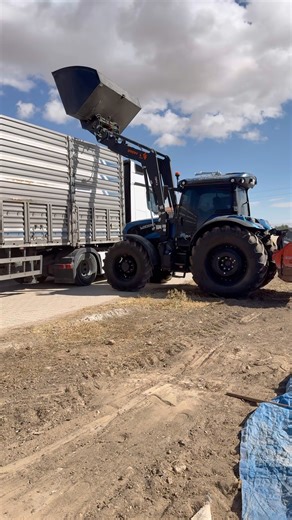 LOADING A TRUCK WITH A TRACTOR BUCKET
