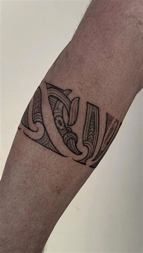 ZEALAND TATTOO on Instagram: "A continuous Māori band, wrapping the forearm with rhythm and meaning. Every curve tells a story, every line holds mana. Done by Inkee @bloodyinkee at our Christchurch studio. #maoridesign #taamokoinspired #forearmtattoo #bandtattoo #blackworktattoo #nzink #christchurchink"