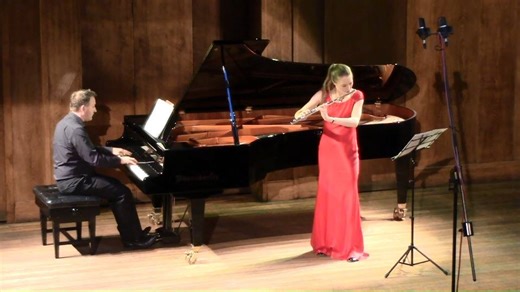 Emma Halnan (flute) performs at the Making Music Philip & Dorothy Green Young Artists Award Concert. Conway Hall, London, 26 June 2018. Emma first came to prominence when she won the BBC Young Musician of the Year's Woodwind award. She has performed worldwide and played concerti with orchestras including BBC NOW, the EU Chamber Orchestra and London Mozart Players. Emma studied at the Royal Academy of Music, where her flute-viola-harp trio held a prestigious fellowship from 2014-16. Recitals with
