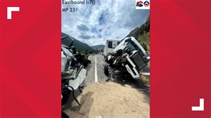 Semi hits man who was working on his truck on side of I-70