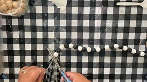 🤯 MIND BLOWN! 🤯 Once you try this trick for painting wood beads, you'll never do it another way! Come discover the quickest and easiest way to make a painted wood bead garland...and of course I had to do this one in BUFFALO CHECK!! Sprinkle, send stars or say something sweet if you loved this one!! Who is going to become obsessed with doing this for all the seasons and reasons?! | Wilshire Collections