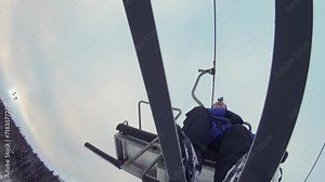 Man makes selfie on cableway in ski resort at winter