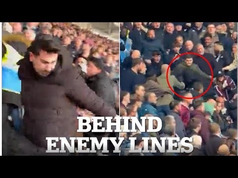 Shocking moment Arsenal fan is thrown down the stairs