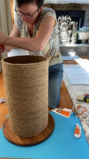 See how to make this adorable spool side table using rope from the dollar tree, 17 3/4" pine wood circle and 12" quickrete tube from Home Depot. | The Crafty Decorator