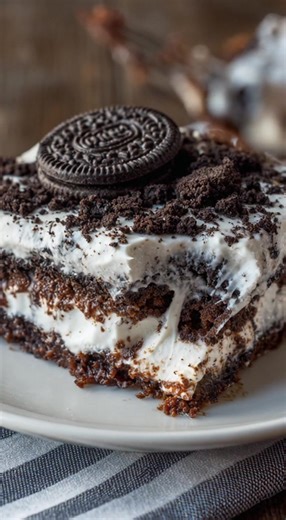 🍪 No-Bake OREO Lasagna 🍫 This dreamy dessert is loaded with layers of crushed Oreos, creamy cheesecake filling, chocolate pudding, and whipped topping — a total crowd-pleaser that’s impossible to resist! 😋 Ingredients: 1 package (14.3 oz) Oreo cookies (crushed) ½ cup melted butter 8 oz cream cheese (softened) ¼ cup sugar 2 tbsp milk 1 container (8 oz) whipped topping (like Cool Whip), divided 2 packages (3.9 oz each) instant chocolate pudding mix 3 cups cold milk Crushed Oreos or chocolate ch