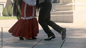 Traditional chotis dance performed by chulapos in Madrid. Chotis is a traditional and popular dance that is performed in Madrid castizo during verbenas and Fiesta de San Isidro. Close up footage.