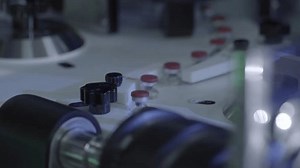 real shot of injection vial filling production line in a biopharmaceutical factory