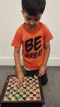 Nivaan teaching snake & ladder