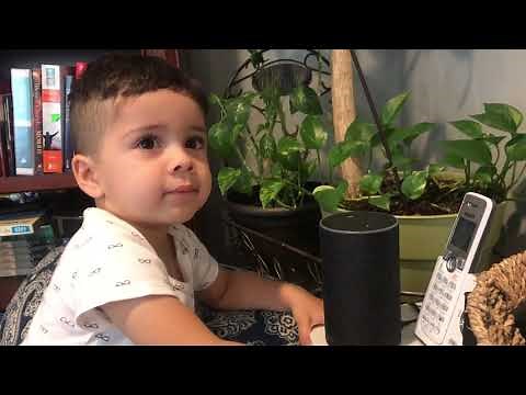 Funny child arguing with Alexa