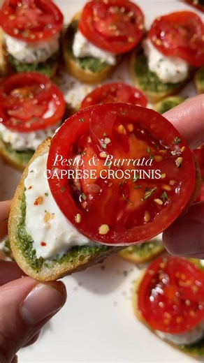 Sheila Williams on Instagram: "Pesto Burrata Caprese Crostinis🍅 if you're looking for an easy appetizer that is sure to impress, make this! I got all ingredients from Trader Joe's, but added some swaps if you don't live near one. These crostinis are DELISH! Let me know if you make✨ •French baguette •TJ's vegan pesto (or regular pesto) •balsamic glaze •campari tomatoes •two burrata cheese balls •aglio olio seasoning (or chopped basil) •extra virgin olive oil •3tbsp melted garlic butter •cut bagu