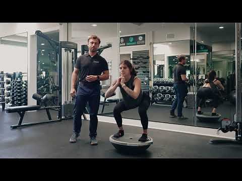 Bosu Ball Squat- A variation of a traditional squat.