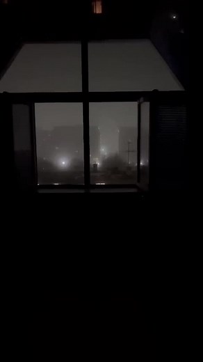 Captivating Nighttime Cityscape View from Window