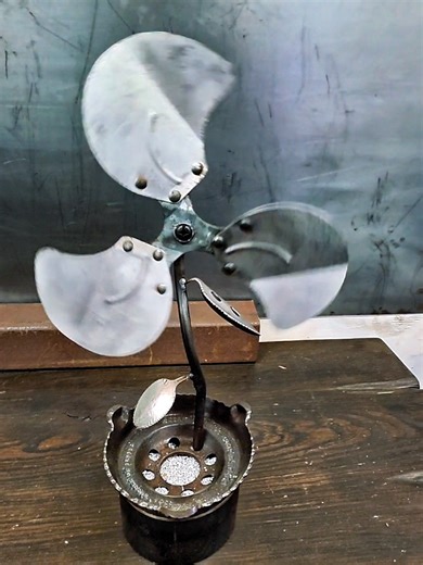 Another cool metal flower, just in time for Valentine's Day! This welded floral art was resurrected from an old fan blade, that still spins, some bent spoons for leaves, and random scrap steel to tie it all in. This flower's magic is in the aluminum potting soil! 😉 #flowerart #floralsculpture #weldingart #scrapmetalart #functionalart