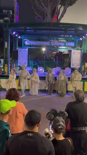 Grim Grinning Ghosts from the Haunted Mansion singing in Downtown Disneyland