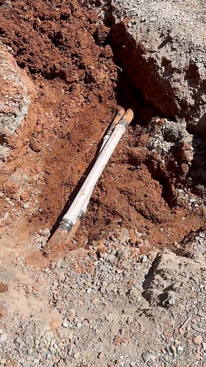 repairing some poly pipe from a ditch water line that got hit during a perc test | Evan Berns