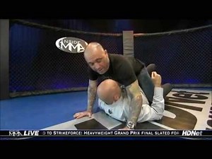 Rogan demonstrating taking the back with Bas Rutten