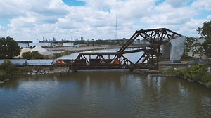 A northbound CN mixed freight rolls across the Conrail Bridge over the Rouge River in River Rouge, MI. | Craig Hensley Photography