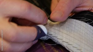 Tailors pad stitch a jacket's lapel and undercollar to give them additional firmness, and maintain their curvature