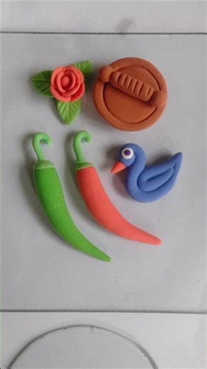 Watch the video on how to make green chilies out of clay #art