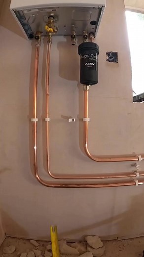 Bending copper pipe into boiler | Plumbing work