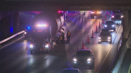 Semi-truck stuck under 11th Street Bridge in Downtown Austin