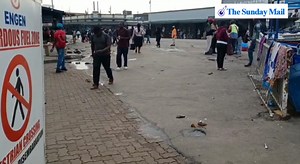 Vendors dry off their wet clothes at the corner of Rezende Street and Robert Mugabe Road in Harare's central business district after getting soaked by the rains on Friday morning 📹 Richard Muponde | Sunday Mail Zimbabwe