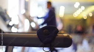 Face mask on a treadmill as an out of focus instructor guides a senior woman on the proper exercise to build immunity and recover from the effects of the coronavirus covid19 pandemic through fitness