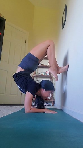 Mastering Scorpion Pose with Wall Support