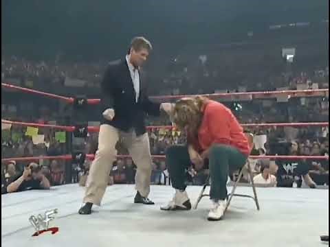vince mcmahon dances to dude love's entrance theme while mick foley sits like a scolded dog