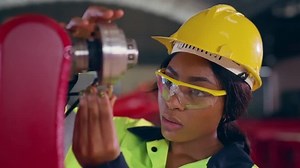 clip-1099076905-female-engineer-maintenance-robot-arm-factory-she