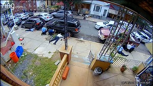 For nearly eight hours Wednesday, police traded fire and negotiated with the gunman in a shootout-turned-standoff in North Philadelphia. Six officers were shot, and two remained trapped for hours in a house with the gunman. A security camera across the street captured a clear view of the events. | Philadelphia Inquirer