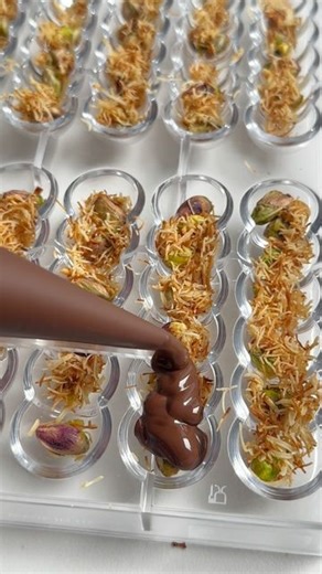 Beshwen B on Instagram: "Chocolate bars with a mix of pistacho and kunafa."