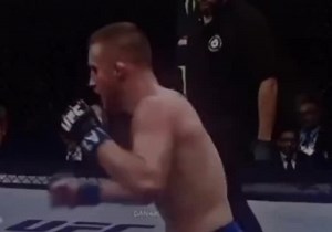 Intense MMA Fight Featuring Muscular Athletes