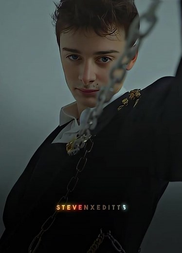 Showcasing Intricate Metallic Chain Suit Design